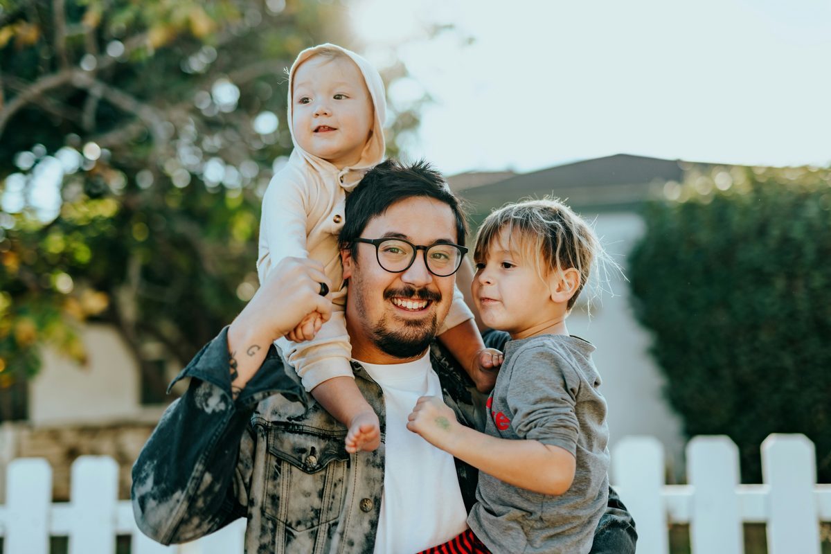 Father with children outside their home
